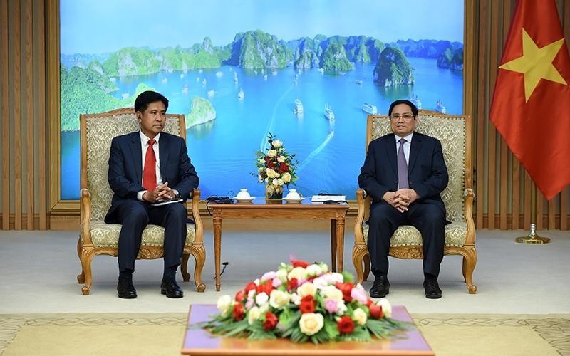Thủ tướng Phạm Minh Chính tiếp Bộ trưởng Bộ Tư pháp Lào Phayvy Siboualypha. (Ảnh: Thanh Hải)
